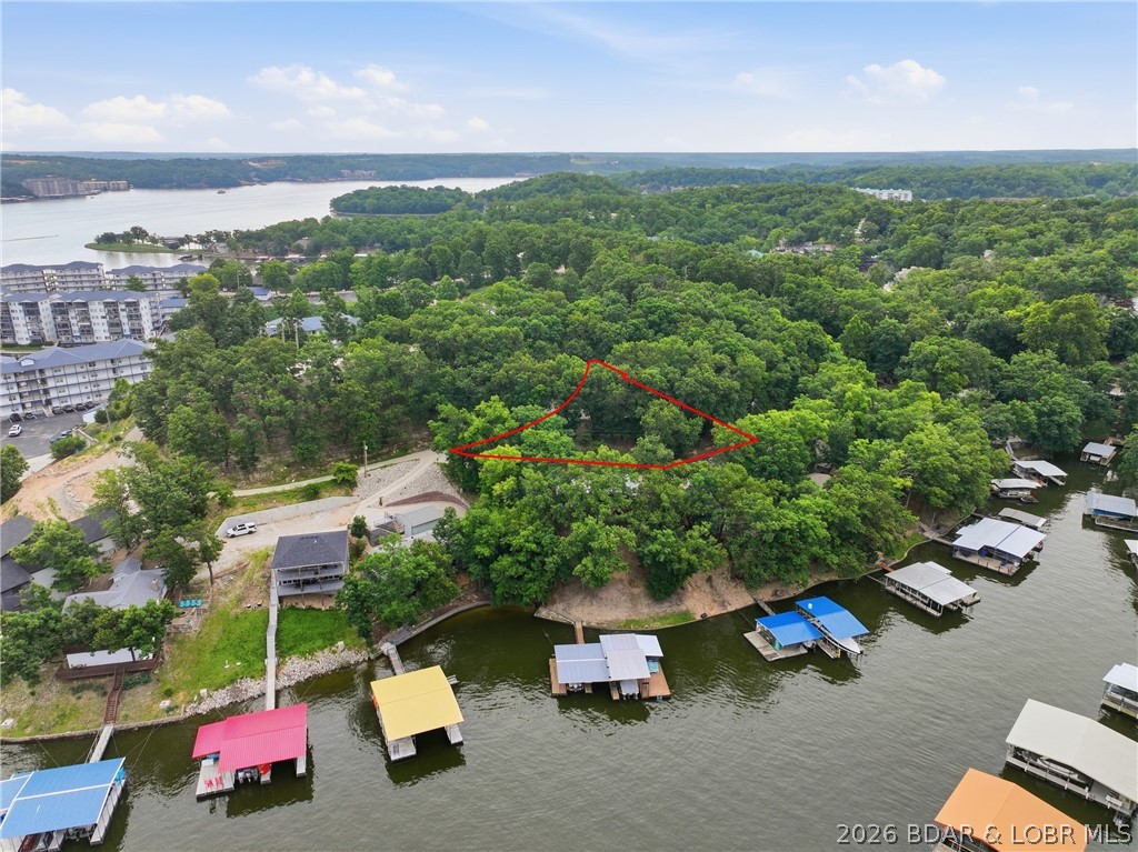 Experience the charm of lakeside living in this beautifully remodeled 3-bedroom, 2-bath home situated on a half acre! Located on a serene lot in the desirable second tier of the lake community, this home offers a cozy deck where you can enjoy a peaceful glimpse of the lake. The interior has been thoughtfully updated with modern finishes, blending style and comfort throughout. From the contemporary kitchen to the inviting living spaces, every detail has been designed for relaxation and easy living. With a beautiful partial view of the lake, this home is the perfect retreat for those who want to enjoy the tranquility of nature while still being close to the water. Don?t miss out on making this lakeside gem your own!