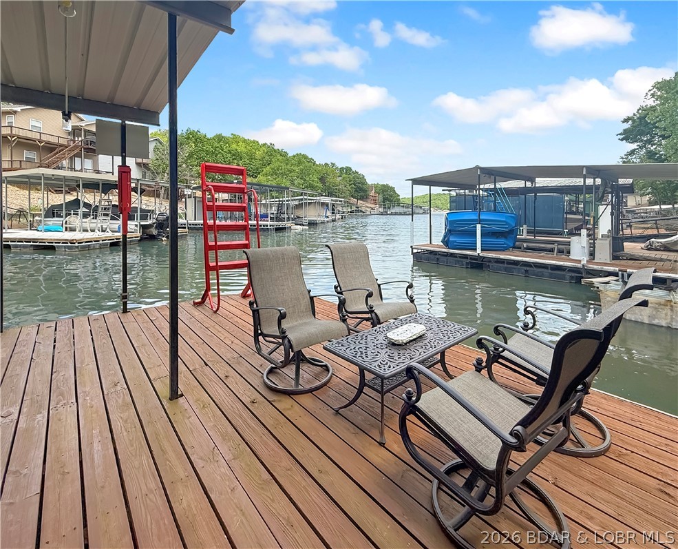 Located in a calm, protected cove at the Lake of the Ozarks, this meticulously maintained 3-bedroom, 2-bath lakefront home at 23 Casa Ct offers comfort, updates, and ideal lake living. The remodeled kitchen provides a clean, functional space for everyday use and entertaining, while major upgrades—including a new roof, HVAC, and water heater—make this a true move-in-ready property.

Enjoy the lake year-round from the screened-in porch, perfect for relaxing or hosting with peaceful water views. Outside, the 2-well dock features great entertaining space including a dock shed with built in bar and easy access to the water, all set in a quiet cove ideal for swimming and floating.

With ample parking for 4+ vehicles, this property offers convenience for both owners and guests—something that’s hard to find on the lake. A well-cared-for home in a great setting, ready to enjoy from day one.