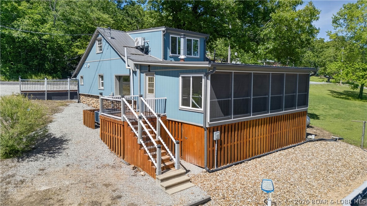 Lakefront, beautifully remodeled property, perfectly positioned on a gently sloping waterfront lot with excellent water depth. This unique home features 1 spacious bedroom with the potential to easily convert into 3 bedrooms, along with 1.5 baths. Completely renovated in 2021, the home blends modern updates with cozy comfort. Enjoy the outdoors & breathtaking lake views from the large Four Seasons room, complete with a dedicated heat pump and a charming backup woodstove—perfect for year-round enjoyment. Inside, you’ll find expansive windows, stylish tile floors & abundant natural light throughout. For boating enthusiasts, the property includes a 2-well dock with200-amp electric service, ensuring convenience and functionality on the water. Six different heat sources and four A/C systems for maximum efficiency and comfort. Newer above-ground saltwater pool for summer relaxation Blacktop Road access for easy year-round entry Incredible Lake views from multiple vantage points Seller has two additional lots available for $22,000 Large carport- 18x 15 x 40 This is a rare opportunity to own a versatile waterfront home with modern upgrades, exceptional amenities, and unbeatable scenery.