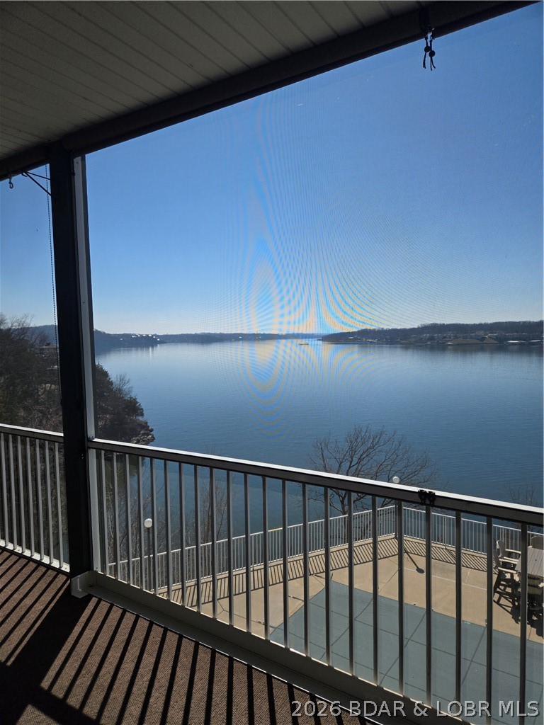 Walking in the front door you will immediately see the 10-mile view of the lake!!! Check out the video. This home boosts 3 bedrooms with king beds with large closets. 3 full size bathrooms. The patio is 450sqft screened in, great for entertaining, have all your meals on the patio. Full size laundry room with a water softener, washer / dryer. New living room furniture, dining room table and chairs seats 6 with views of the lake from any seat.  This location is close to so many restaurants, shops, grocery store, mini golf and go carts tracks, plus we are surrounded by the best golf courses in the mid-west! This is a single building with 12 units, lots of privacy.