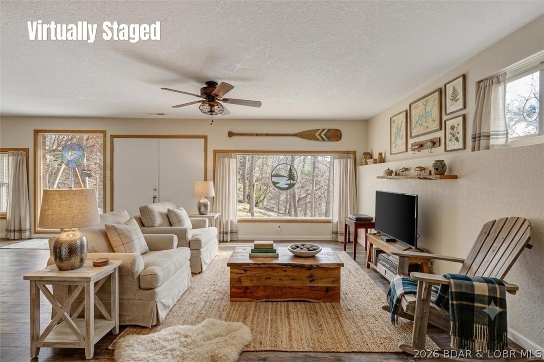 WOW! New Price! Rare opportunity to own 23+ wooded acres with a year-round creek and deeded Lake of the Ozarks access. Perfect for homesteading, hunting, bird watching, wildlife enthusiasts, recreation, or creating your dream hobby farm. This unique earth-contact home offers energy-efficient, low-maintenance living with 3 bedrooms (1 non-conforming), 1.5 baths, and an open-concept layout connecting the kitchen, living, and family room. The spacious primary suite includes a private bath with oversized jacuzzi tub. Flexible floor plan allows potential for additional bedrooms and converting the half bath to a full bath. Rolling acreage with virgin timber provides excellent hunting, hiking trails, garden space, and room for animals or a shop. Abundant wildlife makes this a hunter’s paradise. Property also features a private well, gated circular driveway, utility room with washer/dryer and sink, plus a 10x20 metal shed with electricity for equipment and storage.