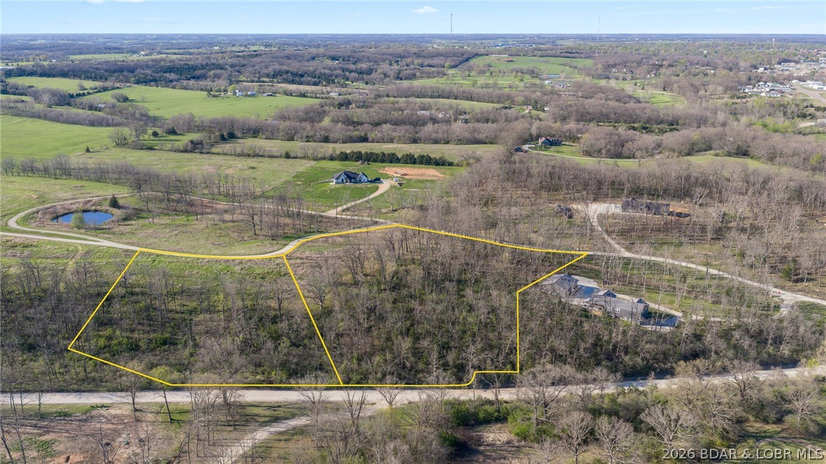 Fantastic opportunity to build the home of your dreams on this beautiful 9+ acre lot just outside of town. Enjoy the perfect pairing of privacy and convenience, with quick access to Highway 54 making trips to Lake of the Ozarks or Jefferson City a breeze. Located just minutes from town, you’ll have easy access to shopping, dining, banking, and everyday essentials. Nestled in a small, quiet subdivision, this property offers the space, tranquility, and ideal setting to create your own private retreat.