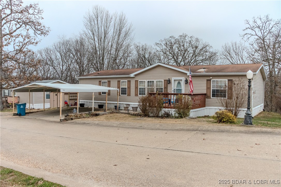 Spacious 4-bedroom, 2-bath manufactured home located in a quiet subdivision, conveniently close to the many amenities offered on the west side of the lake. This well-designed home offers generous living space and a functional layout ideal for comfortable everyday living. The large primary suite features a corner soaking tub and a walk-in shower, creating a relaxing private retreat. Enjoy outdoor living on the screened-in back deck, perfect for unwinding while taking in the peaceful surroundings. Additional features include a 2-car carport for covered parking. The home is not affixed, as the sellers do not own the land. The land is leased for $175 per month. A great opportunity for affordable living in a quiet neighborhood with easy access to shopping, dining, and lake-area attractions.