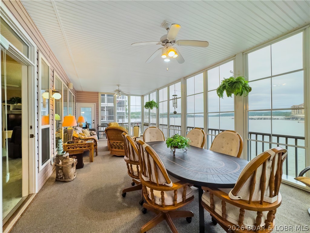 WOW! WHAT A VIEW! THIS CONDO SITS ON THE WATER’S EDGE AT LAKE OF THE OZARKS, CLOSE TO SHOPPING, GOLF, RESTAURANTS, AND HOSPITAL. EFFECTIVE 7-1-26 REDUCED $25,000 dollars, PLUS A TWO CAR GARAGE INCLUDED IN PRICE and ALL FURNISHINGS. No boat docks block your views here, and the water is quiet for swimming and water skiing. This is a small condo complex with only 18 units, and rentals are not allowed. The unit has been updated with granite countertops in the kitchen and updated cabinets in the baths. Also, this condo has been updated with a completely enclosed porch, adding square footage for additional living space. The unit comes with a 12' x 28' Boat slip and lift, plus a PWC slip. OWNER HAS ADDITIONAL BOAT SLIPS for additional dollars. The Horizons also has a fish-cleaning station and 3 docks. YES, THERE IS MORE: INCLUDED HOW IS A TWO CAR GARAGE WITH AN OVERHEAD FLOORED ATTIC FOR ALL YOUR WATER TOYS AND A WORK BENCH WITH PEGBOARD FOR TOOLS. OWNER IS MOTIVATED!!