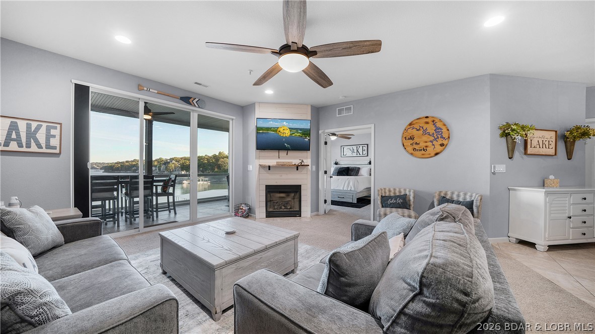 Income-producing property with transferable summer bookings already secured—step in and start earning from day one! Beautifully updated 3-bedroom, 2-bath condo with exceptional main channel views at Lake of the Ozarks. Updated in 2024, this unit features modern finishes, an open-concept layout, and a bright, inviting living space perfect for relaxing or entertaining. The kitchen flows seamlessly into the living area and out to a private lakeside deck with stunning views. Blackout curtains in the primary bedroom and living room add comfort and privacy. Includes a large 14x48 boat slip, ideal for larger boats and maximizing the lake lifestyle.Lands End offers resort-style amenities including multiple pools, a clubhouse, and playground. Conveniently located near the new Oasis at Lakeport, plus popular dining, shopping, and entertainment by land or water.