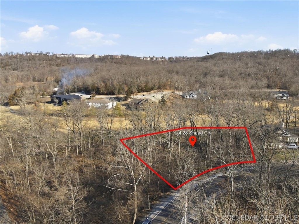 Nestled in the heart of the Village of Four Seasons, this exceptional build lot is located on the golf course within one of the area's most sought-after neighborhoods. The gently sloping terrain is ideal for a custom home with a walk-out basement, offering the opportunity to capture scenic golf course views and outdoor living space. Enjoy the convenience of nearby village amenities while being surrounded by natural beauty. The HOA provides an unmatched lifestyle with access to multiple outdoor pools, an indoor pool, tennis courts, playgrounds, a fitness center, hiking and biking trails, and boat launches. A rare opportunity to build your dream home in a premier location.