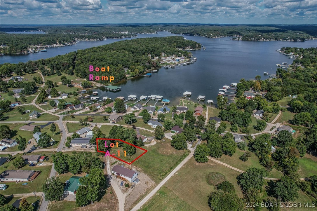Lot A-11 in Johnsons Bay subdivision is a .41acre lot with a good view of the lake, this lot is perfect for that walk out lower-level home. Enjoy lake access via subdivision boat ramp. Hard to find lots this cheap with water and sewer hook ups! Several parcels have sold this year making Johnsons Bay a HOT area! Located at the Gravois 3mm and super close to many of the lake's hottest waterfront attractions!