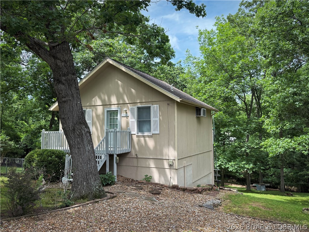 Lake of the Ozarks retreat located in the desirable Keithley’s Beach area! This well-maintained home offers comfortable living with a spacious primary bedroom and a large living room, perfect for relaxing or entertaining. Enjoy the convenience of an owned dock slip, making lake days easy and accessible. The home also features a generous workshop space ideal for hobbies, storage, or projects, along with a versatile basement rec room that can accommodate additional sleeping space for guests. An included lakefront lot provides added value and opportunity—perfect for building a shop, creating a gathering area, or simply enjoying the beautiful lake views. With paved roads all the way to the property and a great location near the water, this is an excellent opportunity to enjoy everything the Lake of the Ozarks has to offer. Schedule your showing today!