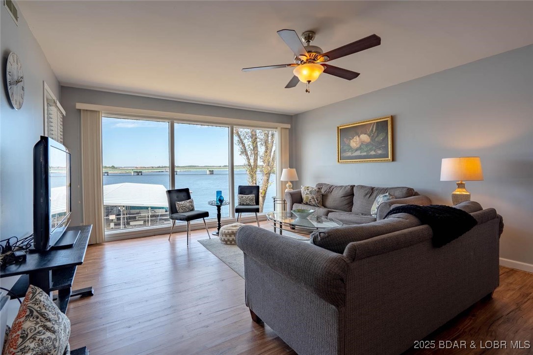 Beautifully maintained 2-bedroom, 2-bath condo at Parkside Place with spectacular main channel views—right where the famous SHOOTOUT races take place! This unit offers elevator access to the condo, dock, and pool. Features include an open layout, modern updates, tasteful furnishings, extra storage, and a private balcony overlooking the State Park. Never rented, only personally owned and cared for. Includes a 10x30 boat slip in the protected community dock with wave break. Move-in ready for immediate lake enjoyment!