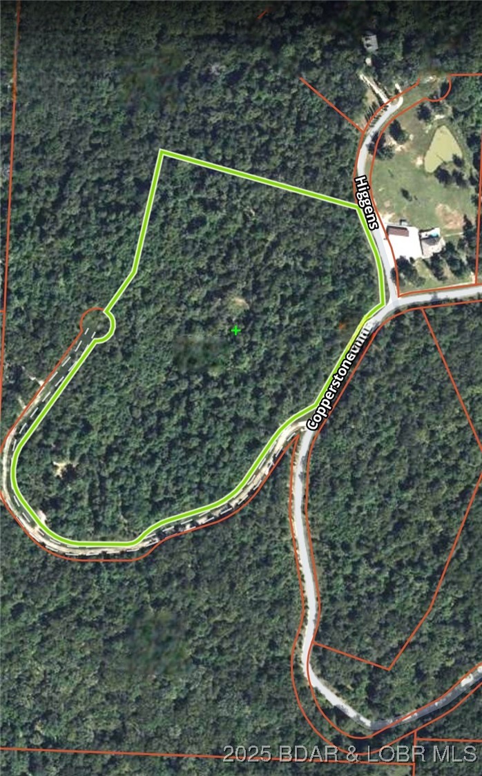 Discover more than 18 acres of beautiful wooded property at the Lake of the Ozarks, already divided into four separate lots, creating exceptional flexibility for a private estate, family compound, investment opportunity, or future resale. Multiple cleared, level building sites are ready for your dream home, weekend getaway, or custom development. Outdoor enthusiasts will appreciate the abundant wildlife, including whitetail deer and turkey, with established food plots making this property a true hunter's retreat. The mature timber provides privacy, natural beauty, and potential timber value. Conveniently located just minutes from Highway 5, Highway 7, the Hurricane Deck Bridge, a public boat ramp, and several popular lakefront restaurants, you'll enjoy quick access to boating, fishing, golf, shopping, and all the recreation the Lake of the Ozarks has to offer. Located near Camdenton in an area of quality homes, this unique property offers the perfect combination of peaceful country living, investment potential, and convenient access to the lake lifestyle.