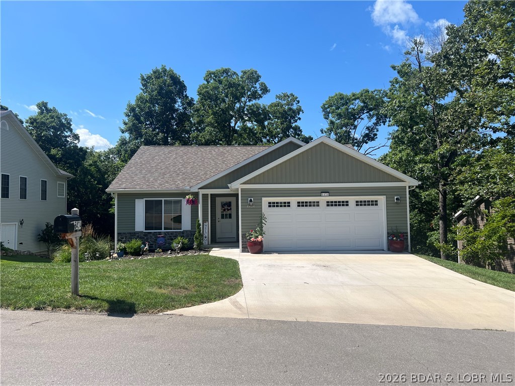 Lake of the Ozarks Move-in-ready newer-construction home in the heart of Osage Beach! Main-level living, a tree-lined backyard, and everyday convenience just minutes from Lake of the Ozarks dining, boating, golf, shopping, and medical plaza. 

The main level features an open-concept living room/kitchen, dining area with deck access, primary en-suite bedroom, second bedroom, full bath, laundry, 2-car oversize garage. Start the morning with coffee on the deck, unwind after a day on the water, and settle into an easy, low-maintenance full-time home close to everything Osage Beach has to offer. 

The lower level adds a private third bedroom, full bath, and oversized second living area ideal for a game room, media room, guest retreat, hobby space, or playroom. A 5-person hot tub overlooks the serene tree-lined backyard, creating a relaxing outdoor space with added privacy. 

You’ll also love the massive lower-level storage area, 12x8 backyard shed, maintenance-free LeafGuard with MicroNet, NEW Bosch dishwasher, water softener, NEW washer/dryer, and TV mounts in all bedrooms and living areas. Located in highly sought-after School of the Osage district.