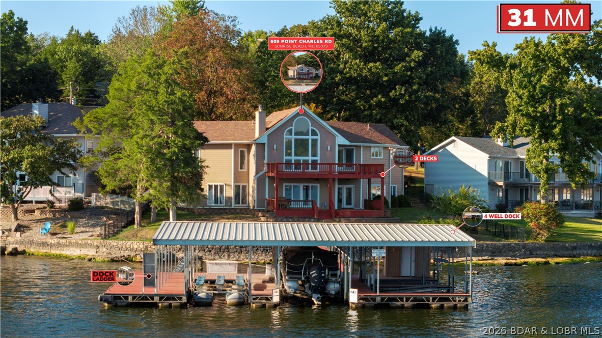609 Point Charles Rd in Sunrise Beach offers luxury lakefront living with 3,700 sq ft, main-level living, and breathtaking views at the 31 MM. This 4-bedroom, (4th bedroom is nonconforming)2.5-bath retreat features vaulted ceilings, an open floorplan, 2 gas fireplaces, custom cabinetry, wet bar, and a spacious lower-level great room with pool table included. Enjoy upper and lower decks overlooking 100 ft of shoreline, a fenced lakeside yard, seawall, and an impressive 3-well covered dock with 12x40 and 12x28 slips, 4 PWC spaces, hoists, and swim platform. Updates include a 2025 furnace and garage door system, 2023 water heater, and 3-year-old roof. Attached 2-car garage, plus the lot across the street is included, providing room to build another garage or shop.