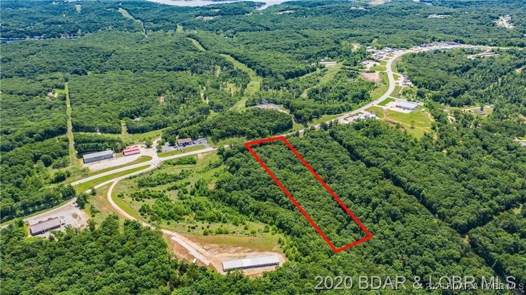 Prime highway front acreage ready for building a new commercial development! Located just a few miles from the community bridge and the heart of the westside, this property is positioned perfectly for some of the highest traffic counts and conveniently located for all the lake’s customers. The development of the contiguous property is thought to increase traffic counts further. A private entrance from the highway can be put in easily as well as city water and sewer can be run to the property as well. You have all you need to start developing this gentle 5 acres. Call today for a private viewing!