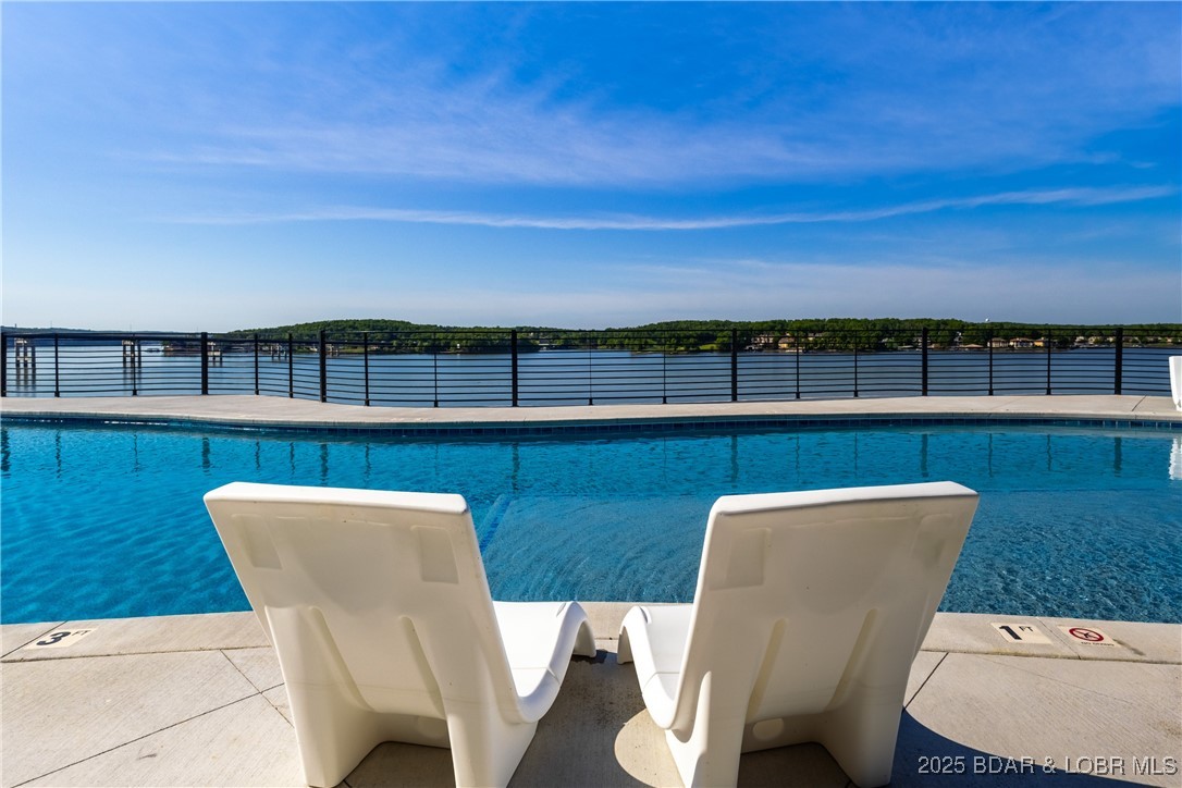 The Toy Box is located at the Lake of the Ozarks most recognized intersection at Horseshoe Bend and Bagnell Dam Blvd. in Lake Ozark, Missouri. With a 180 degree Panoramic View of Lake of the Ozarks, these Lux Loft units are like nothing else in the area. This unit is (25’ x 60’ with 23’ side walls and a mezzanine) for Residential use only. The development will be governed by a Condo Owner Association and offers  a pool, clubhouse with full indoor kitchen, innovative gym, pickle-ball court, basketball court, A boat wash area and RV pump out allow you to work and play within your own community. An observation deck overlooking miles of Lake of the Ozarks shoreline truly set this property apart from all others, while giving you the peace of mind of a gated community! All of this just a minute drive from the buzzing Bagnell Dam Strip. Come be a part of the Lake of the Ozarks where We Have a Lifestyle For You!