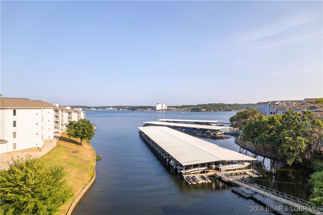 Embrace "The Lake Life" just in time for the 2026 season with this stunning, turnkey 3BR/3BA end-unit condo. Situated on the top floor for maximum privacy, this home offers an expansive open floor plan perfect for entertaining, featuring a large master suite, a spacious dining area, and a versatile bonus room that flows seamlessly into the main living space. Recent high-end upgrades include new luxury vinyl flooring, a brand-new HVAC system, and a fresh awning over the private deck—the ideal spot to watch boats pass by, rain or shine.  Boaters will love the included 12x36 slip and a dedicated storage unit for all your water toys and fishing gear. Located in the desirable Regatta Bay community, you’ll enjoy access to two pools, tennis and pickleball courts, a clubhouse, and two pavilions. Whether you’re looking for a full-time residence or a summer getaway, this meticulously maintained property is ready for immediate enjoyment.