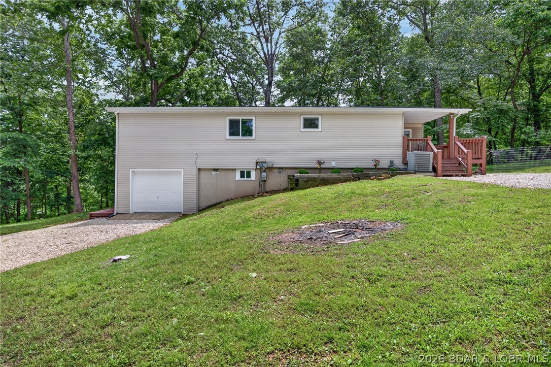 Some homes ask for your time before you can enjoy them. This one gives it back. Updated from the kitchen and bathrooms to the flooring, paint, and siding, this 3 bedroom, 3 bathroom home is ready from day one. The space feels comfortable and easy to settle into, whether you're coming home after work, escaping for the weekend, or welcoming family and friends to the Lake. The garage offers room for storage, hobbies, and everything that comes with everyday life, while the turnkey condition means less time spent on projects and more time enjoying where you live. Last-minute plans become easier when everything is this close. Grab dinner at Baxter's or JB Hooks, meet friends at the Strip, spend an afternoon shopping, catch a movie, or simply enjoy having some of the area's favorite destinations practically in your backyard. For those looking at investment potential, the turnkey condition and proximity to some of the Lake area's most visited destinations create an opportunity that is increasingly difficult to find. Whether you're searching for a full-time residence, weekend getaway, or short-term rental opportunity, this is the kind of property that makes saying "yes" feel easy.