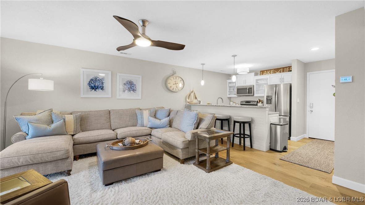 Show-stopping 2BR/2BA condo at the 17MM in Osage Beach! Completely updated in 2021 with luxury vinyl plank flooring, custom cabinets, granite countertops, fresh paint, updated fixtures, and beautifully remodeled bathrooms. No corners were cut on this full remodel. The master suite features Carrara marble tile and a spacious walk-in shower and custom walk-in closet creating a true retreat. Located in the highly desirable Indian Point community, this prime lake-area location offers outstanding amenities including three pools, tennis court, clubhouse, promenade, and more. By land and water, you are right in the action of the best lake attractions. Best of all, this condo is already on a rental program—making it an ideal turnkey investment or low-maintenance lake getaway. Sit back, relax, and let this condo work for you!