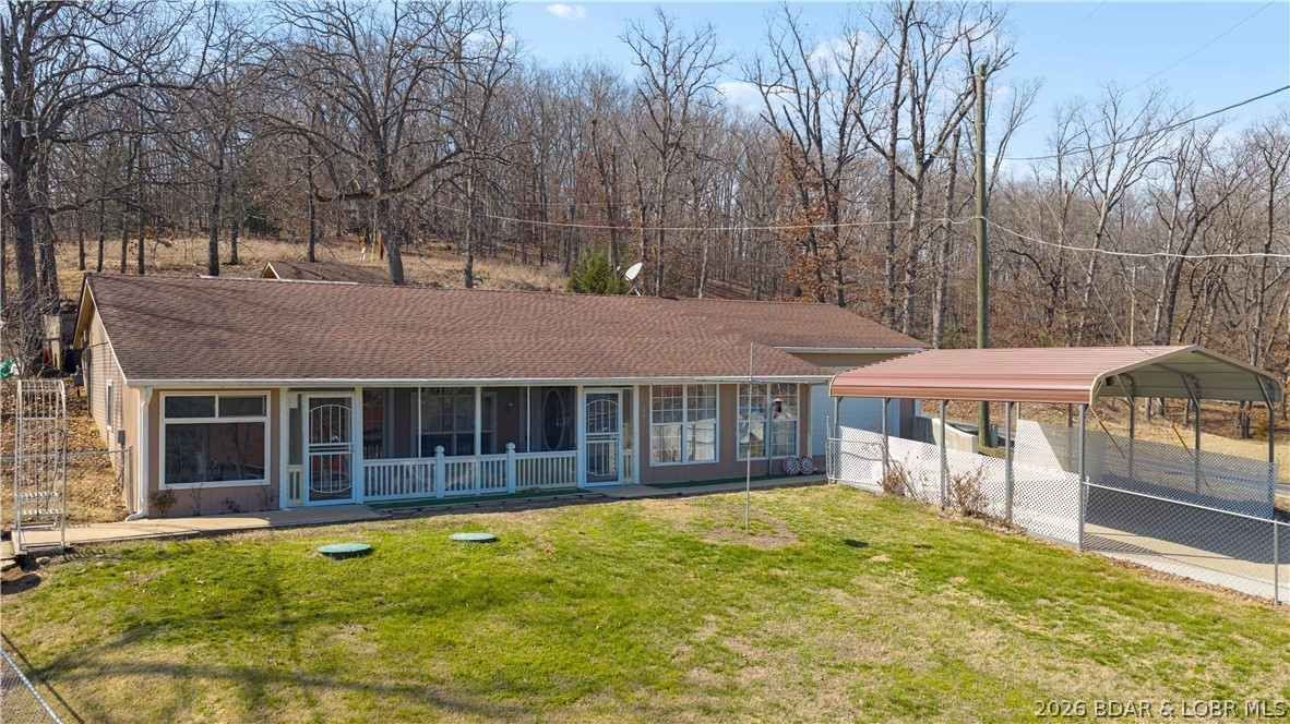 Step into this inviting 3-bedroom, 1-bath home in the heart of Gravois Mills, where comfort, efficiency, and scenic charm come together beautifully. This well-maintained, energy-efficient property features thoughtful updates throughout—including a brand-new septic system for worry-free living. Take in peaceful lake views from your own home, or relax year-round in the bright sunroom, complete with a hot tub that creates the perfect personal retreat. The fenced yard offers plenty of space for pets, outdoor entertaining, or simply enjoying the fresh air. Ideal as a full-time residence or a weekend escape, this cozy gem is ready to welcome you home. Now offering a 5-year home warranty for added peace of mind!