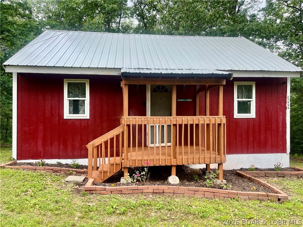 Lake Life Doesn't Have to Break the Bank!  Take a look at this cozy 2-bedroom, 1-bath cabin nestled on 1.25 wooded acres and priced under $100,000! Turn-key and ready for you to start enjoying summer at the lake, this property offers the perfect blend of privacy, relaxation, and outdoor adventure. Enjoy your morning coffee on the covered front porch and unwind in the evenings on the covered back porch surrounded by nature. Located just under 5 miles from conservation access, you'll have quick access to some of the area's best fishing, boating, and outdoor recreation. And for the anglers, you'll love the fish cleaning station already set up right in the backyard—making it easy to clean your catch and get back to enjoying lake life. Whether you're looking for a weekend getaway, fishing cabin, investment property, or affordable full-time home, this one checks all the boxes!