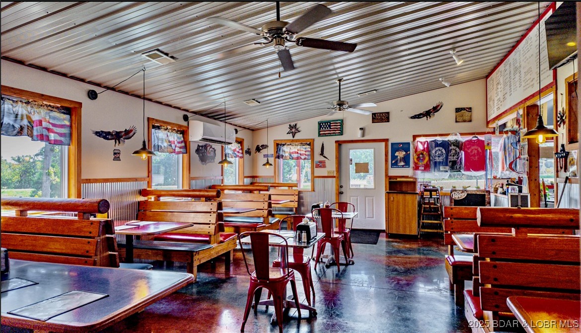 RESTAURANT INCLUDES A HOUSE AND GARAGE!  This thriving restaurant at the Lake of the Ozarks is minutes from Ballparks National and in close proximity to the Macks Creek School, also featuring HIGHWAY 54 traffic counts with high visibility. This restaurant is always busy and a mainstay of the community on west Highway 54 with the traffic flow coming into the Lake Area being some of the best you will find on the major thoroughfare of Highway 54. Built on a large double lot, this current restaurant could be used for other business visions due to the great location and high visibility and ample lot size being over 2 acres.  Parking opportunities there are tremendous and can park as many cars as you would need with a little expansion into the second lot. Plenty of room to add on to the original structure with the double lot. Next to the Dollar General and easily accessible from the highway with easy access into the building it accommodates all potential customers with ease.  The Hillbilly Hut has a great following and a wonderful reputation.  Building and lot have great potential, the business is a bonus.