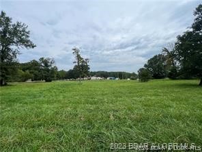 Very Gentle lake access lot located at the corner of Towering Oaks and Fox Run Road in Johnsons Bay. This lot would be ideal for a 1 level slab on grade home.  This area is very appealing as there is already Central water and Sewer in place, currently supplied by Central States Water Resources. There is a hookup fee TBD, with low monthly rates that are currently $27 for water and $47.50 for sewer.  Additionally, there is a common area with lake access with a boat ramp located next to the community dock. This area contains moderate to high end homes.  Take a look at the value here.