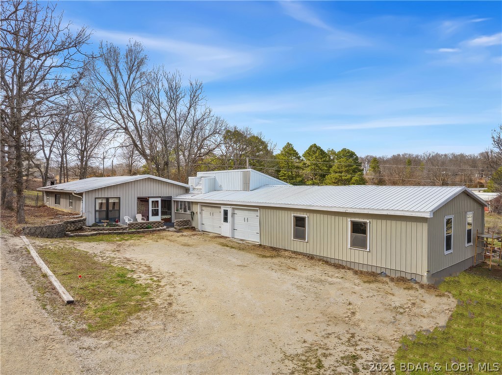 Ranch Home on large level corner Lot.  Open Living/Kitchen/Dining Floor Plan.  Kitchen has Stainless Steel Appliances, Oak Cabinets, Pantry & lots of Shelves.  Master Bedroom/Bath has a Jetted Tub, large Mirror with Medicine Cabinet and Walk-In Shower.  Back Yard is Fenced in for your pets with a nice Patio.  There is an attached 2-Car Garage, Workshop, Greenhouse and Storage area.  3-Phase Electric is close. Great Home Location close to the Lake whether you are looking for a Family Home, Investment Property or Business Location this one checks all the boxes.