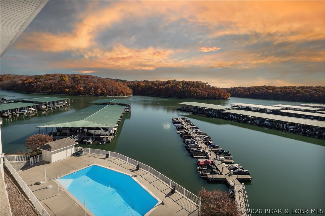 Top-floor, two-story lakefront living in the heart of Osage Beach! Where every detail is designed around how you actually want to spend time at the Lake. Located in the sought-after Parkview Bay complex, this unit offers a rare sense of privacy paired with sweeping views of the state park. Inside the two-story layout gives everyone their own space, with a main-level living area that naturally flows to the outdoors & an upper-level loft built for gathering, games, & extra guests. Days here start on the lakeside deck with coffee overlooking the water, & end just minutes away from the Lake’s most popular waterfront spots. Tucked into the Grand Glaize arm, you have easy access to the energy of the main channel, along with calmer coves perfect for swimming, skiing, or simply floating the afternoon away. With a large boat slip + 2 PWC spaces, & fully furnished - everything is already in place - just show up & start enjoying lake life the way it’s meant to be. Call today to see it for yourself!