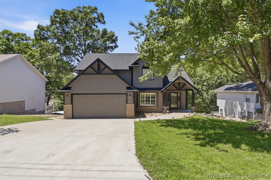 MOTIVATED SELLER!!!! Conveniently situated just off Bagnell Dam Blvd, this spacious waterfront home offers city water, city sewer, paved roads, and easy access to shopping, dining, and entertainment. Designed with comfort and functionality in mind, the home features 4 bedrooms, including a versatile bonus room that can serve as a 5th bedroom, media room, or office. The main-level living floor plan includes a generous primary suite, formal dining area, cozy kitchen with a breakfast nook, and an impressive great room highlighted by vaulted ceilings and expansive windows that showcase lake views. Multiple decks provide the perfect setting for relaxing or entertaining outdoors. A level driveway leads to the attached 2-car garage, while the massive walk-in crawl space offers approximately 1,500 square feet of additional storage or potential future living space. Outside, enjoy a 1-well dock and a gently sloping lakeside yard with plenty of room for a fire pit, outdoor seating, or your own waterfront oasis. This property is ready for you to start making Lake of the Ozarks memories this summer! DON'T MISS IT!!!