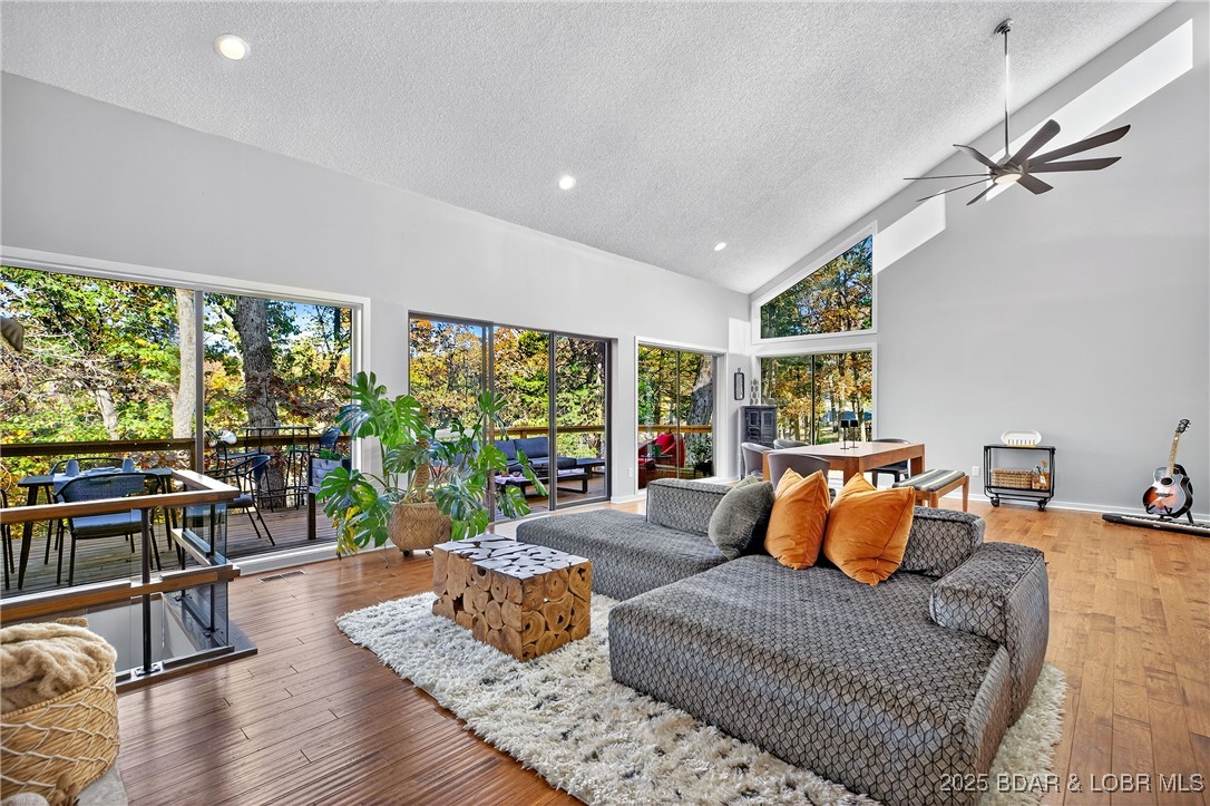 Blackhawk Estates is offering a rare and unique multi-level floorplan with a beautiful, intuitive flow—each level serving its own purpose and giving everyone private spaces to unwind. As you walk in, the main living area welcomes you with quality construction details, a decorative fireplace, a comfortable dining space, and access to a wide deck with a peaceful seasonal lake view. Just off the entry is a guest wing featuring a bedroom and full bath, ideal for visitors or anyone wanting easy main-level access. A few steps up, the primary suite sits privately on its own level, wrapped in windows that make you feel like you’re living in a treetop village. This retreat includes a balcony, an updated bath, and a walk-in closet. The middle level hosts the kitchen along with another bedroom and its own full bath—creating a layout where rooms feel separate yet connected, perfect for households wanting both togetherness and personal space. The walkout lower level offers a second gathering area w/ a pellet fireplace, a cozy media nook, a half bath, and direct access to the patio and yard. Black Hawk Amenities are just down the street. Wood burning fireplaces are for looks & not functional.