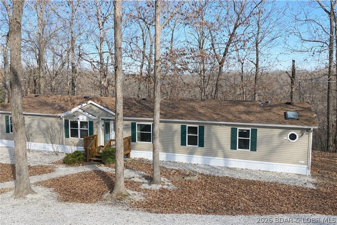 Discover the perfect blend of privacy and convenience with this 4 bedroom, 3 bath home on 11 beautiful acres in Rocky Mount. Inside, you’ll love the vaulted ceilings and spacious layout designed for comfortable living. The large kitchen features an island, abundant cabinetry, and plenty of storage, making it ideal for gatherings and everyday life. Generous bedrooms offer walk-in closets, and with two separate family rooms, there’s space for everyone to spread out and relax. Step outside and enjoy the possibilities! The 1,200 square foot shop is a standout feature with concrete floors, electric, water, and a finished area ready for your workshop, studio, office, man cave, she shed, or hobby space. Located just minutes from Coffman Beach and a short drive to town, this property offers the peace of country living with easy access to lake fun and amenities. Acreage, space, and versatility—this one truly has it all!