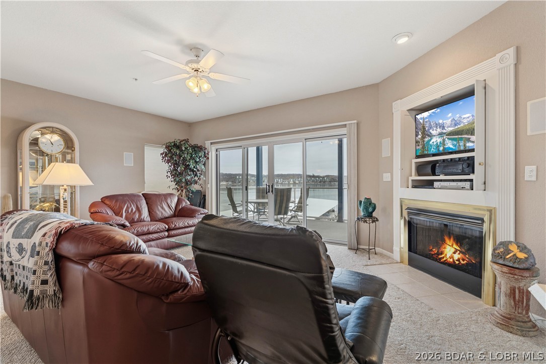 Lake life should be simple—and this one makes it easy. Welcome to Monarch Cove at the 2-mile marker in Lake Ozark, this 3 bed, 3 bath unit offers a great combination of lake views, protected dock access, and a highly desirable location by land and water. Being in one of the buildings positioned out on the point allows for wide views of the lake, while Dock 1 provides calm water that makes pulling in your boat and PWCs easy. The package includes a 12x36 boat slip with hoist along with two PWC slips and hoists, giving you plenty of room for all your lake toys. The condo is being sold turn-key, so it’s ready to start enjoying the moment you arrive. A covered porch provides the perfect place to relax with your morning coffee or unwind after a day on the water while taking in the lake views. Monarch Cove is known for its prime location near the 2-mile marker, just minutes from the Bagnell Dam Strip, waterfront restaurants, shopping, and many of the lake’s most popular attractions. Whether you're looking for a personal lake retreat, a place for family gatherings, or a strong investment opportunity, this condo offers the ideal setup to enjoy everything Lake of the Ozarks has to offer.