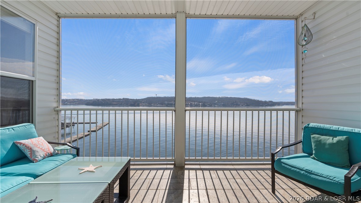 Experience turnkey lakefront living at its finest in this beautiful 3-bedroom, 2-bath WALK-IN condo at Isla Del sol! Located in the best building in the complex with completely unobstructed views, of Lake of the Ozarks! The well-designed floor plan provides comfortable, easy living with a spacious feel and seamless flow. Meticulously maintained and move-in ready, this condo is ideal for weekend getaways or full-time lake life. Nightly Rentals are welcome. Boating enthusiasts will love the massive 14x40 boat slip INCLUDING a 10,000lb Polylift! If you’ve been waiting for the perfect combination of location, view, and convenience, this is it. Your next lake adventure starts here at Isla Del Sol! Call for a private showing today!