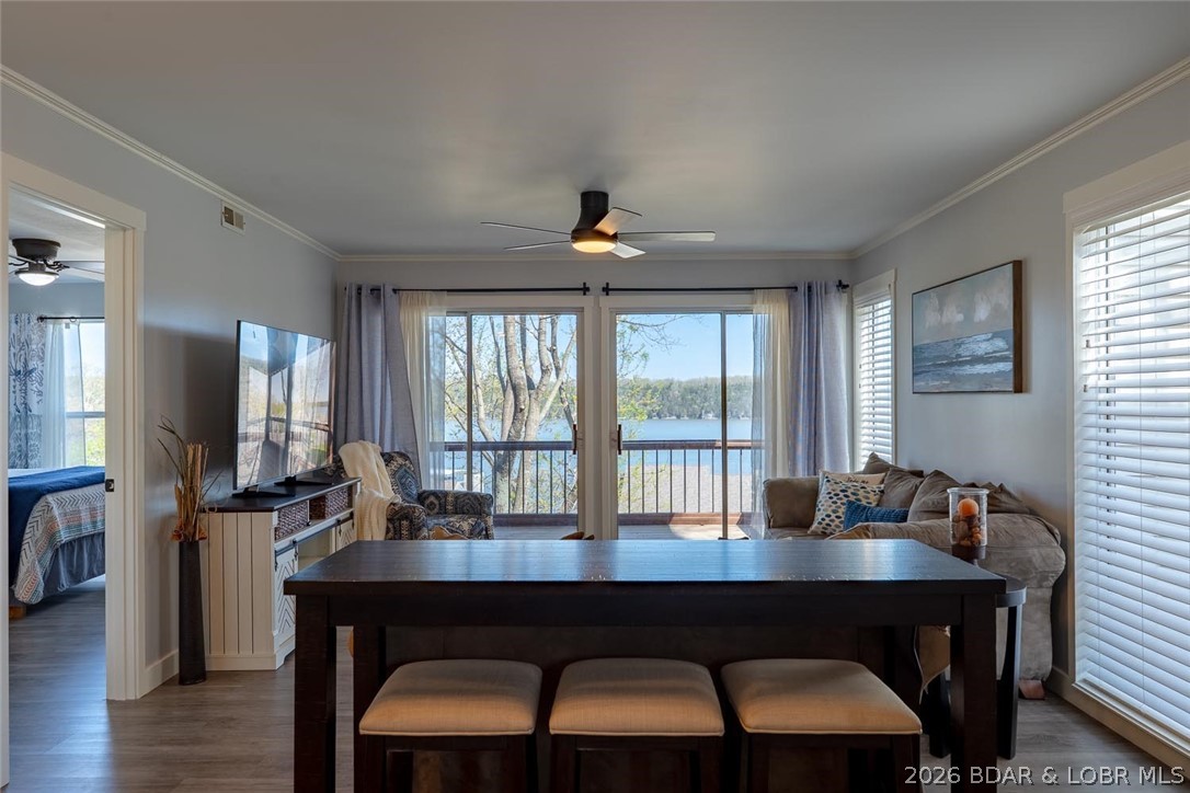 Indulge in breathtaking waterfront views from this beautifully appointed 2-bedroom, 2-bath condo featuring an open-concept living area and kitchen, perfect for entertaining. Both bedrooms offer comfortable accommodations, and the screened-in balcony with storage is ideal for relaxing, sunset watching, or enjoying lake activity. This unit is being sold turnkey and fully furnished, making it completely move-in ready for summer. Located at the 22 MM in the heart of Osage Beach, you’ll love the convenience to popular restaurants and entertainment by land or water. The community offers great amenities including a swimming pool, basketball court, and playground. A brand-new community concrete dock that is being installed right now adds to the appeal, along with your own 12x32 boat slip for easy access to the water. Whether you're looking for a personal getaway or rental investment, this condo offers the perfect blend of relaxation and convenience for lake life.
