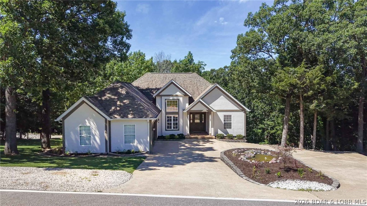 Located on a quiet cul-de-sac w/seasonal lake view in the highly sought-after Summit Point subdivision, this beautifully updated 5-bed home offers the combo of space, convenience, & amenities that buyers are searching for. Extensive updates have already been completed, allowing the next owner to simply move in & enjoy. Recent improvements include new flooring on the main level &stairs, custom metal handrail w/cable railings, a stunning new primary bath, solid-core doors, 5" baseboards, 6" gutters w/guards, irrigation system, heated/cooled garage, & a 50-amp outlet for electric vehicle charging. HVAC is only 9 years old & still under warranty. Inside, you'll find multiple living areas, a formal dining room, eat-in kitchen, lower-level family room w/fp, bonus/gym space/theater room, & flex space. Residents love Summit Point for its low HOA dues & exceptional amenities including a community pool, lighted tennis/pickleball courts, basketball court, playground, & firepit area. The golf-cart-friendly location provides easy access to Dierbergs Markets, shopping, dining, & everyday conveniences. Fully updated homes in Summit Point rarely become available—especially one this move-in ready.