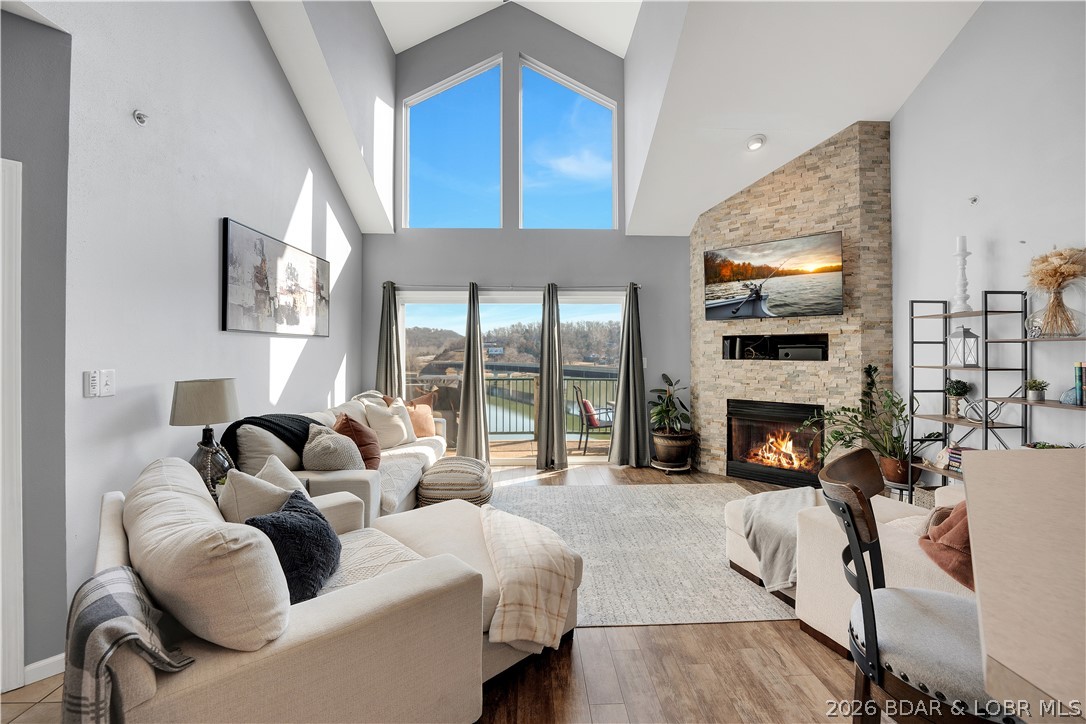 Experience lake living in this 4-bedroom, 2-bath penthouse condominium with approximately 1,923 sq ft in Cedar Heights—perfect for a family getaway! The open layout features vaulted ceilings, abundant natural light, and a stone fireplace. Two outdoor spaces—a screened deck and sun deck—are ideal for relaxing and enjoying the views. The kitchen offers stainless steel appliances, a spacious peninsula, and tile backsplash. The primary suite includes vaulted ceilings, a walk-in shower, and walk-in closet. A second bedroom connects to a Jack-and-Jill bath, with an additional main-level bedroom. The upper-level loft provides flexible space plus a fourth bedroom with walk-in closet and plumbing for a potential third bath.

Located in a calmer water area, this condo is perfect for swimming, floating, and lake fun. Includes a 12x30 boat slip. Community amenities feature three pools and maintained common areas. Convenient to golf, dining, shopping, entertainment, and Ballparks National. Seller will pay all levied special assessments. Nightly rentals allowed. Offered furnished for a turnkey experience; some antiques and personal items not included. Don’t miss this fantastic lake condo!