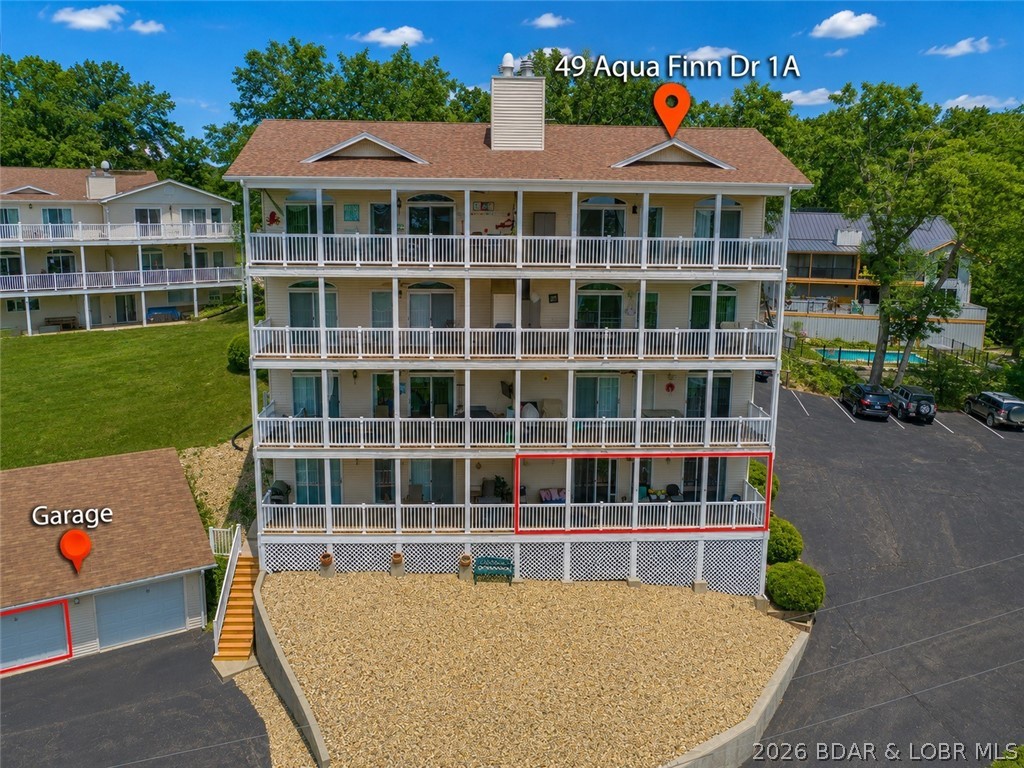 Lakefront Living with Rare Extras in the Heart of Horseshoe Bend! This beautifully updated walk-in level 2B/2B condo offers the perfect combination of comfort and convenience. Located in one of the Lake's most desirable areas, you'll enjoy quick access by both land and water to premier restaurants, shopping, and entertainment. Inside, you'll find a spacious open floor plan featuring durable tile, Pergo flooring, updated lighting/décor, pantry, built-in hutch, black appliances, washer/dryer, water softener, 80-gallon water heater. The primary suite features a jetted tub, walk-in shower, double vanity, walk-in closet, and direct access to the covered lakeside balcony. The guest bedroom offers private access to a full bath. This package is truly hard to find and includes an on-site garage, 12' x 28' boat slip with hydraulic hoist, two PWC slips, one PWC lift, and one additional PWC lift pad. Whether you're searching for a full-time residence, weekend getaway, or investment property, this exceptional lakefront condo checks every box. Start making unforgettable memories at the Lake of the Ozarks—schedule your private showing today!