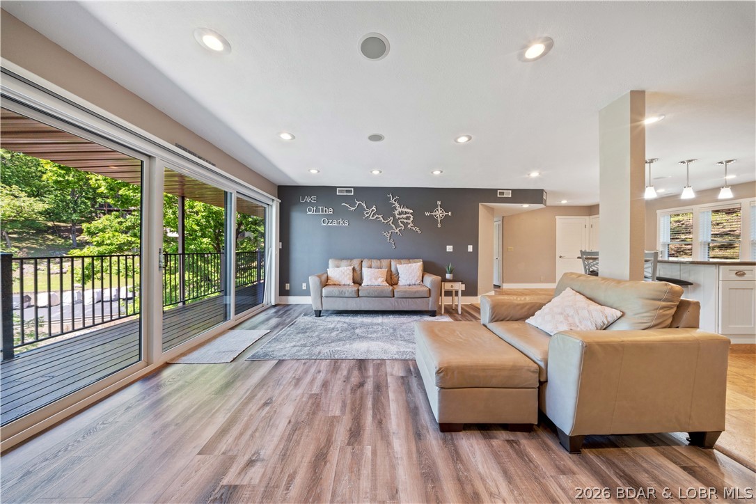 This updated 4-bedroom lakefront condo on Horseshoe Bend delivers the space, modern finishes, and prime location buyers search for on Lake of the Ozarks. Fully renovated down to the studs in 2009, it features durable LVP and tile flooring, an open floor plan, and a spacious, walk-around kitchen island perfect for cooking, gathering, and entertaining. The deck offers peaceful lake views, overlooks your boat slip, and provides a front-row seat to the iconic holiday fireworks. The complex is known for being quiet, well-managed, and beautifully maintained, with amenities including a pool and clubhouse. Mature trees and expansive grounds create a park-like setting ideal for dog walks and outdoor relaxation. Conveniently located just past the Lodge of the Four Seasons, this sought-after Horseshoe Bend address offers quick access to restaurants, golf, marinas, and lake attractions. With its rare bedroom count, updated interior, and premium lakefront setting, this condo is a standout choice for full-time living, vacation use.
Includes all furnishing as well as a 10'x28' boat slip and #4000 boat hoist!!Golf cart for sale to complete the package! Floorplan included w/pictures.