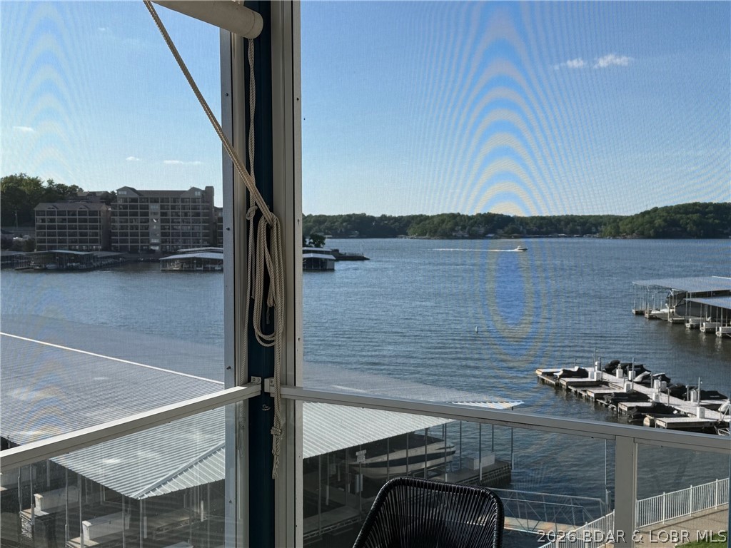 Don't miss out on this beautiful walk-in end unit at Monarch Cove.  That's correct No steps from the parking lot to the door of this awesome 3-bedroom 2 bath condo.  And the elevator is about a dozen steps from the front door of the unit waiting to take you to the 12x36 boat slip and/or the 2 PWC slips.  This is a Turn-Key sale so you can stay in your new condo the first night!  Being an end unit it provides a main channel and cove view for your enjoyment.  This very clean unit is ready to be Yours!  Enjoy Monarch Cove living with the amazing pools and the location is just minutes from golf, shopping, restaurants, and Bagnell Dam.