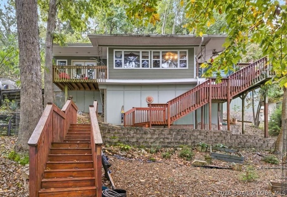 Charming lakefront cabin delivers the perfect blend of relaxation, comfort, and value. Whether you’re looking for a full-time retreat, weekend getaway, or investment opportunity, this property is packed with upgrades and ready to enjoy from day one. Inside, the smartly designed layout maximizes every space. The spacious master suite features an electric fireplace, office nook, and balcony overlooking the water. Start mornings in the cozy dining nook with beautiful lake views and coffee in hand. The fully remodeled 2023 kitchen showcases quartzite countertops, a large island, and brand-new stainless steel appliances — ideal for entertaining. Efficient mini-split systems provide year-round heating and cooling comfort. Step outside to enjoy lake living at its best. The oversized deck with a roll-out canopy is perfect for relaxing or hosting guests. Easy water access is provided by both a tram and staircase leading to the two-slip dock, and the outdoor shower is perfect after a fun day on the lake. Adding even more value, a newly constructed 2024 detached metal building with dual-entry doors offers abundant storage, workshop space, or room for all your lake toys.