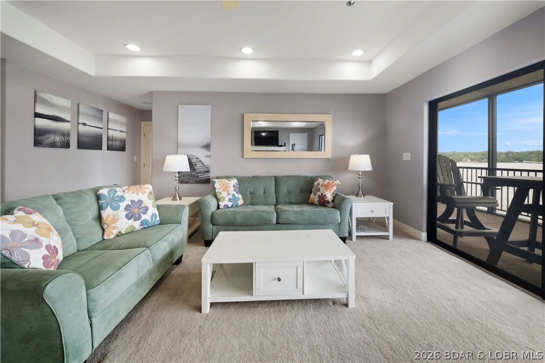 If you’ve been searching for a Lake Ozark condo with breathtaking main channel views, walk-in unit access, and room for family and guests, this one checks every box. Located at the 2 Mile Marker in the highly desirable Falls Condominiums, this turnkey 3-bedroom, 3-bath lakefront condo offers a spacious layout with two en suite bedrooms and stunning water views throughout. Large sliding glass doors open to a screened-in deck overlooking the lake, creating the perfect space to relax and enjoy unobstructed Lake of the Ozarks views.

Enjoy true walk-in access from parking, plus elevators that take you down to the lower level and cove-protected community docks for easy lake access. This unit also includes a reserved garage parking space, boat slip, and PWC lift, making lake days simple and stress-free. Whether you're looking for a full-time residence, vacation getaway, or investment property, this condo is move-in ready so you can start enjoying lake life immediately.

The Falls amenities include a community pool, playground, tennis courts, and beautifully maintained grounds in a prime Lake Ozark location close to waterfront dining, shopping, and entertainment.