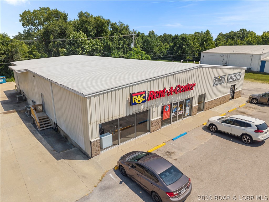 Position your portfolio for long-term success with this exceptional income-producing commercial property located on Business Highway 54 in Eldon. Situated next door to Walmart & surrounded by established national & local businesses, this property offers outstanding visibility, strong traffic counts, & a highly desirable location in one of Eldon's busiest commercial corridors. The 5,000 SF building is divided into two 2,500 SF units, both of which are occupied by long-term tenants, providing immediate cash flow. With stable rental income already in place, this is an ideal turnkey investment for buyers seeking a low-maintenance commercial asset with proven performance. The metal building features ample parking, excellent road frontage & easy access from Business Highway 54, ensuring maximum exposure for its tenants. As Eldon continues to experience steady growth & increasing commercial activity, opportunities to acquire fully leased properties in premier locations like this are becoming increasingly rare. If you're looking to expand your investment portfolio this property delivers the combination of location, stability, and long-term income potential that investors are searching for.