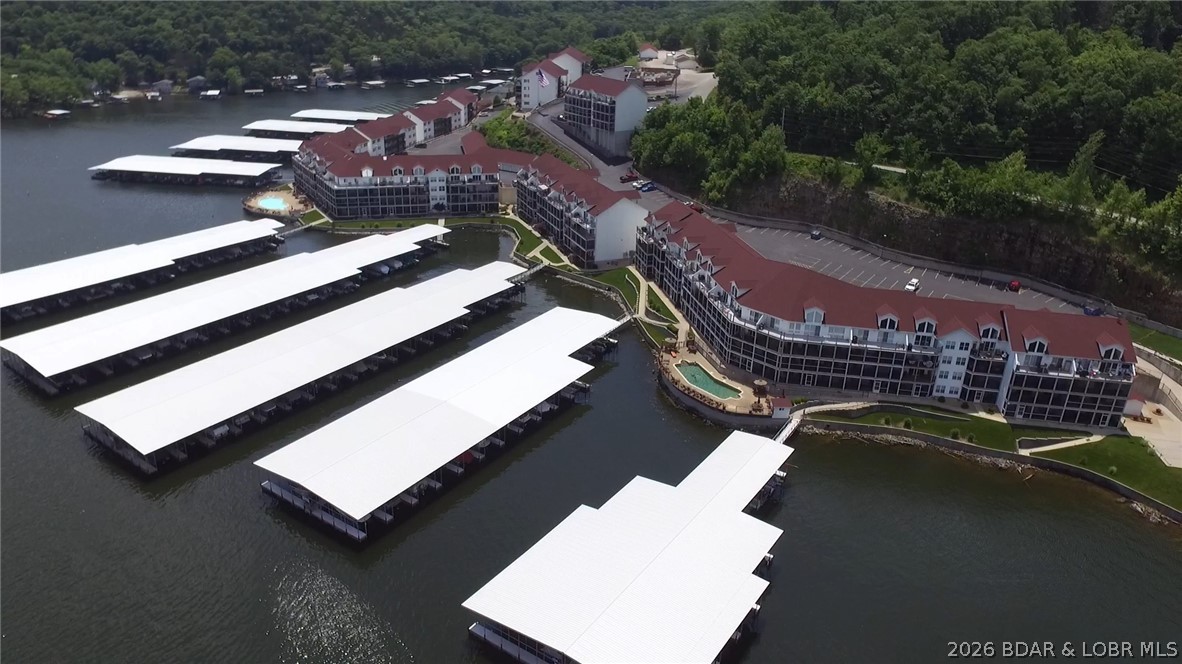 Located in the highly sought-after Clearwater Condominiums (Camdenton area) at the Lake of the Ozarks, this beautifully updated 3-bedroom, 2-bath lakefront condo offers one of the community's best locations. Ground-floor living provides direct walk-out access to the lake, docks, pool, and your 40-foot boat slip, just steps from the lakeside screened deck. 

This move-in-ready condo features a brand-new kitchen, new flooring throughout, a remodeled master bath, and a newer high-efficiency HVAC system.

This is the ONLY Clearwater condo connected to the adjoining unit by both an interior door and exterior deck access. Purchase both units to create a unique 5-bedroom, 4-bath lakefront retreat with two kitchens, two living rooms, and an expanded double-sized deck. The units can also be separated by locking the demising doors, allowing them to be rented together or independently.

Included is an extremely rare 40-foot boat slip - one of only six in Docks A–H. The adjoining 600-1B also includes a double Sea-Doo slip. Clearwater is one of the Lake's premier condo communities, offering outstanding amenities, beautiful grounds, and excellent lake access. Rare opportunity!