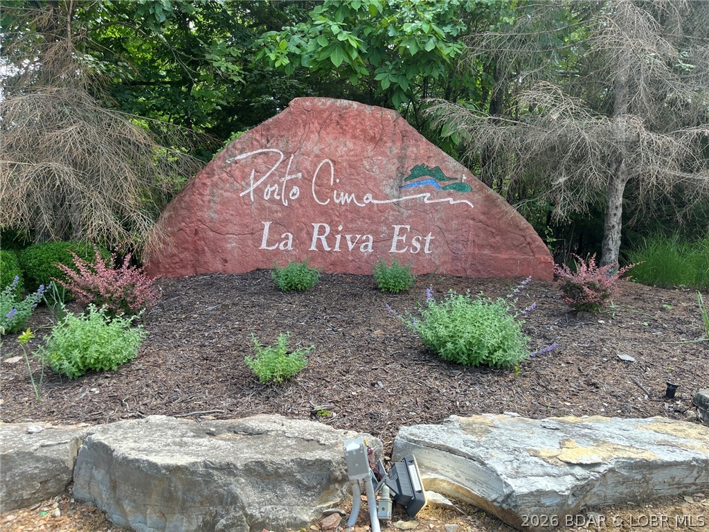 Priced to sell and ready for you to build your dream home. Easy to build on the large level portion. Porto Cima offers access to swimming pools, tennis and pickleball courts, bocce ball & horseshoe pits, club house as well as access to the Jack Nicklaus Signature Golf Course. The Club at Porto Cima Club is located nearby across MM from lot. The HOA fee covers most Four Seasons amenities. There is a additional charge for owners who use the Four Seasons fitness club, boat storage, or campground. Membership at The Club at Porto Cima is additional. Boat slips are available at the Yacht Club. Nearby Community bridge is now toll free allowing quick access to both sides of the lake.