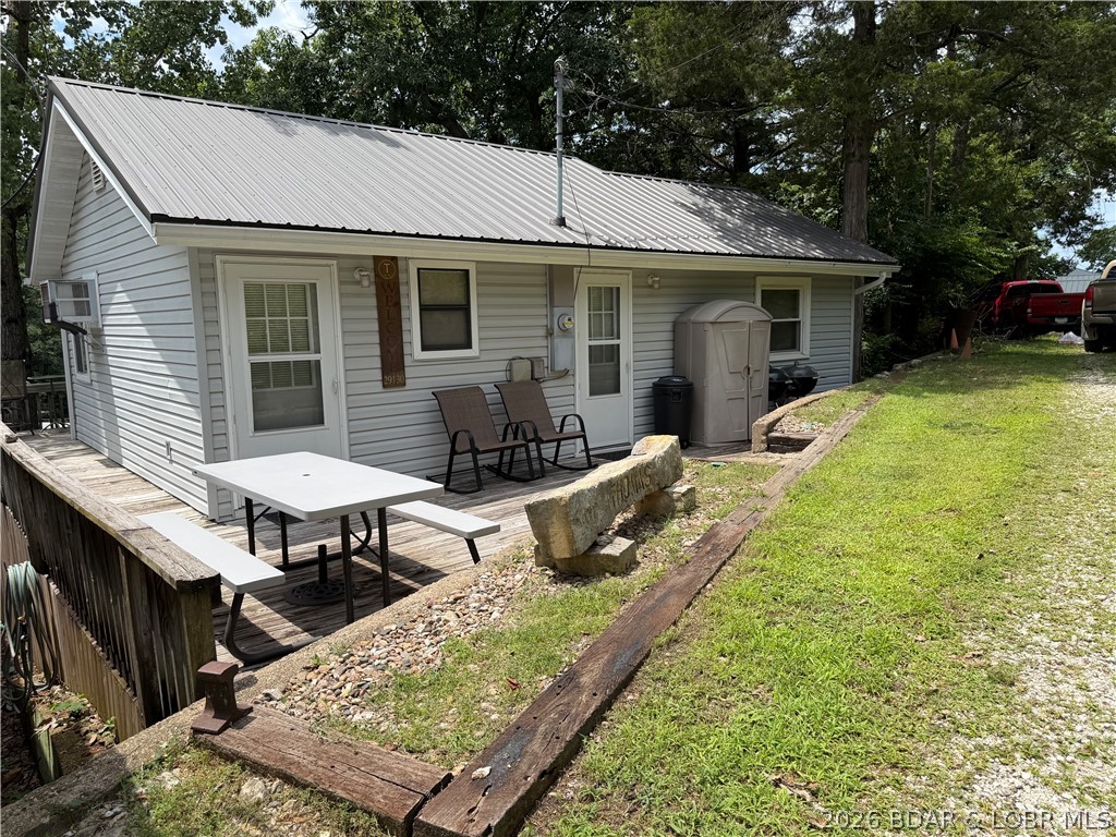 Looking for an affordable way to enjoy the Lake, here's your answer! Grounds are maintained by the HOA so very little maintenance for you, a 10x24 slip in a community dock with a lift, a wonderful screened porch on the lakeside with shade to enjoy it with a seasonal view! Open deck on the side and part of the lakeside to sit and relax and make your cares go away! The home has 1 non-conforming bedroom (no closet), 1.5 bathrooms, kitchen with stove & refrigerator. The living area is great for multiple sofa beds to accommodate family and guests! Space is well designed. Owners have a cubbyhole box for each person to put their "stuff" in and not have it cluttering the place! Their is a community area beyond the community dock for a quiet, safe place for kids and adults to swim or float and has a flat platform to relax in the sun. The roadside deck has a picnic table to enjoy meals or just visit. The lot across the road from the house is just vacant land to enjoy the view and quiet. Doesn't get much easier than this! Put this on your list to view at the lake!