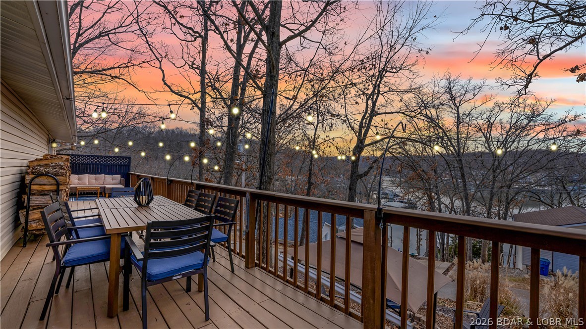 SUCCESSFUL, ESTABLISHED NIGHTLY RENTAL & affordable lake area living in the heart of Osage Beach with updates, convenience, and lake views. This 3 bedroom, 1 bathroom home offers 960 square feet and is ideally located near Hwy 54, shopping, the hospital, and local favorites like Millers Landing - where you can rent a boat slip! Positioned 2nd tier, the home captures a nice lake view while maintaining easy access to everything the area has to offer. Inside, the home has been tastefully updated with new flooring, newer appliances, updated bathroom, and is being offered with stylish furnishings throughout, creating a true move-in ready opportunity. Outside, enjoy a newly added outdoor fireplace entertainment area, a second entertainment area in front of the home, and plenty of parking for guests. The property has been meticulously cared for and is set up for both personal use or rental potential. Whether you're looking for a weekend lake retreat, full-time residence, or a nightly rental opportunity, this property offers flexibility, location, and value all in one.