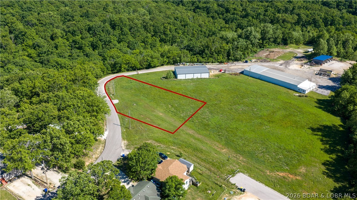Incredible commercial opportunity for apartments, which is a huge need for the Camdenton city limits!  Over 5.5 acres with an opportunity for a tax abatement for 7+ years remaining.  For qualified developers, this tax credit will save 50% of real estate taxes with the county and no sales tax on any items purchased for the construction of new apartments, time frame for this tax abatement ends in a little over 7 years.  Flat and usable ground and city that is in need for housing besides section 8.  Multiple ingress and egress is available with these two lots, owned by the city.  Don't miss out on a developers dream in Camdenton today!