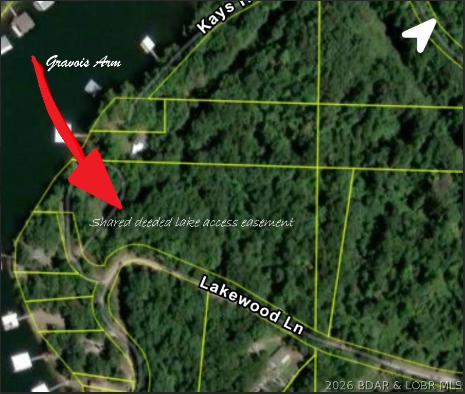 Own your very own peace of paradise with a shared recorded deeded lake access easement to Lake of the Ozarks which allows swimming, fishing, and kayaking. Gently sloping property offering added flexibility for build. No planning or zoning restrictions and no HOA fees. Pop up that camper and live off the grid! Protective covenants in place to help preserve value. Ideal for a shouse, personal storage building, or future home site. Agent is the trustee for this property. Tax bill is from a larger tax bill, therefore tax bill is to be determined.