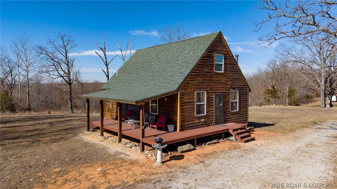 Tucked away in a peaceful natural setting, this 37± acre property offers the perfect blend of privacy, recreation, and rustic comfort. The charming 2-bedroom, 1-bath home is ideal as a full-time residence, weekend retreat, or hunting getaway. Warm up by the wood-burning fireplace/stove, and enjoy the cozy loft-style second bedroom, adding character and extra sleeping space. Surrounded by mature timber and abundant wildlife, the land is a haven for deer and turkey hunting, hiking, and exploring. Located just a couple of miles from the Little Niangua River, you’ll have easy access to kayaking, swimming, fishing, and floating, making this property a true outdoor enthusiast’s dream. Whether you’re looking to unplug, hunt, or enjoy the beauty of the Ozarks, this secluded acreage offers endless possibilities and room to roam—all while still being within reach of nearby amenities.