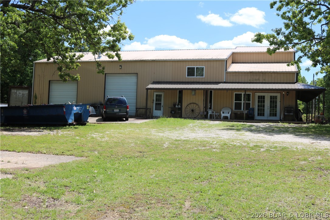LARGE COUNTRY HOME WITH HIGHLY DESIRABLE LOCATION. ALMOST 4200 SQUARE FOOT UNDER ROOF WITH 1760 SQUARE FOOT BEING FINISHED GARAGE SPACE WITH 16 FOOT CEILING AND 12-FOOT-TALL OVERHEAD DOOR.  THIS THREE BEDROOM, THREE AND ONE HALF BATH OFFERS CHARM YET EASY LIVING SIMPLICITY. YOU WILL LOVE THE GOURMET KITCHEN WITH CUSTOM HICKORY CABINETRY AND HUGE PANTRY. ENORMOUS MASTER SUITE WITH TREMENDOUS HUGE WALK IN SHOWER. ENJOY THE COVERED PORCH AND LOVELY QUIET SETTING WITH PLENTY OPPORTUNITY FOR WILDLIFE VIEWING, GARDENING, EXPANSION AND PEACEFUL QUIET COUNTRY LIVING WITH CLOSE TO TOWN CONVENIENCE. THIS PROPERTY HAS OVER SEVEN SURVEYED ACRES WITH SIGNIFICANT STATE RT O HIGHWAY FRONTAGE FOR FUTURE ENHANCEMENT. HOME SITS BACK OFF THE HIGHWAY ISOLATED FROM NOISE AND NEIGHBORS FOR THE PERFECT TRANQUIL SETTING.