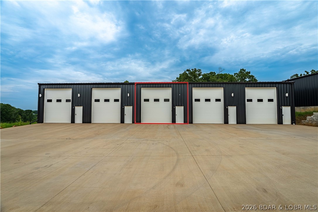 The Kingdom at Lake of the Ozarks is a shouse community and mancave style storage units centrally located near MM13, just off Highway MM in Sunrise Beach right across from The Villages. This unit is offering a bathroom, kitchenette, a mezzanine, Epoxy floors, Large ceiling fans and an RV Dump station. Awesome location, featuring paved roads to the entrance. Storage units are individually metered, finished with electric and offering 200-amp service. Mini split included for climate control. Steel lined and insulated interior, oversized overhead door as well as a man door. All LED lighting and central water and sewer.